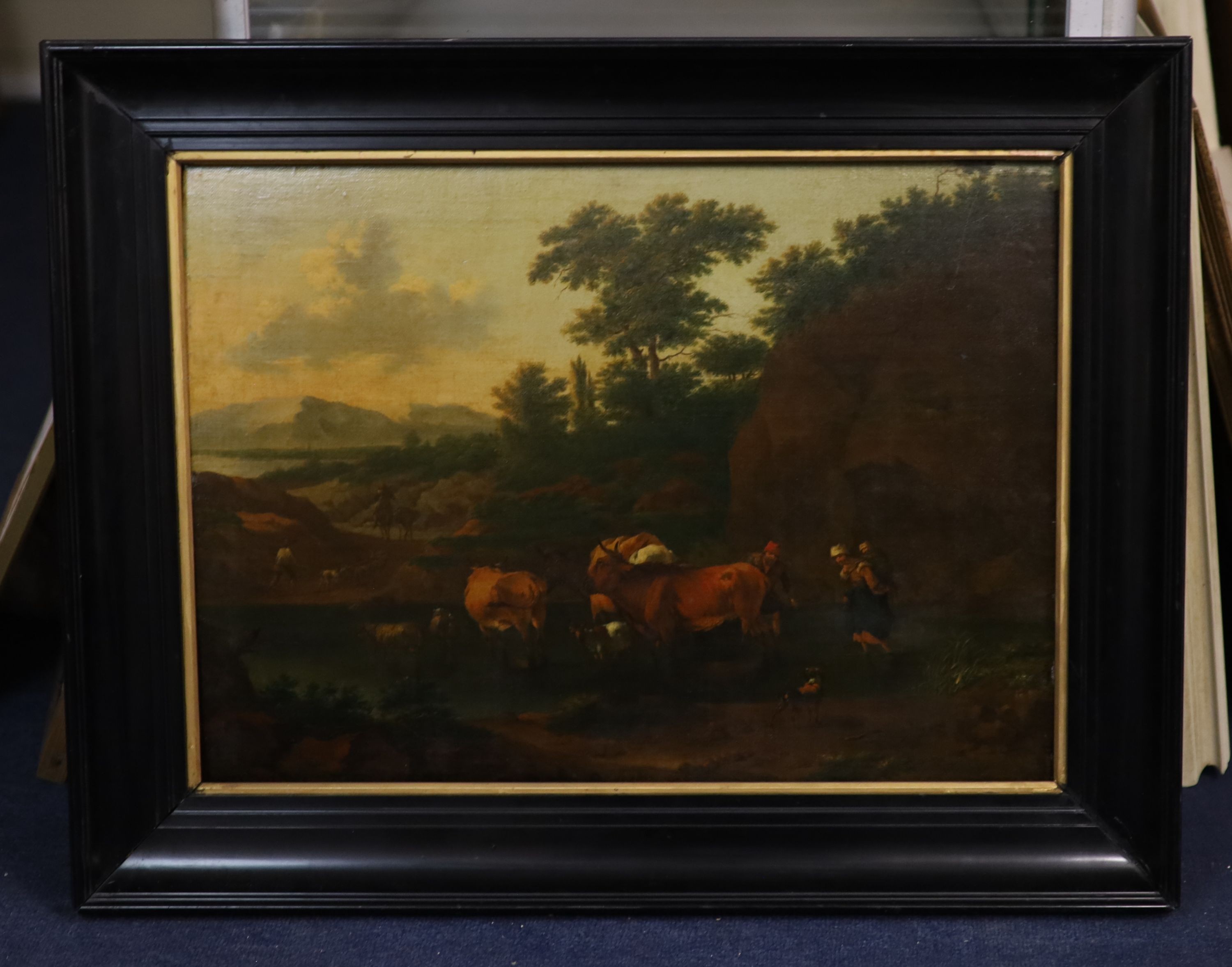Attributed to Nicholaes Berchem (Dutch, 1620-1683), Landscape with cattle drovers crossing a river, oil on canvas laid onto a wooden panel, 41 x 57cm